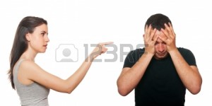 Unhappy young couple having an argument. Isolated on white. Stock Photo - 14025650
